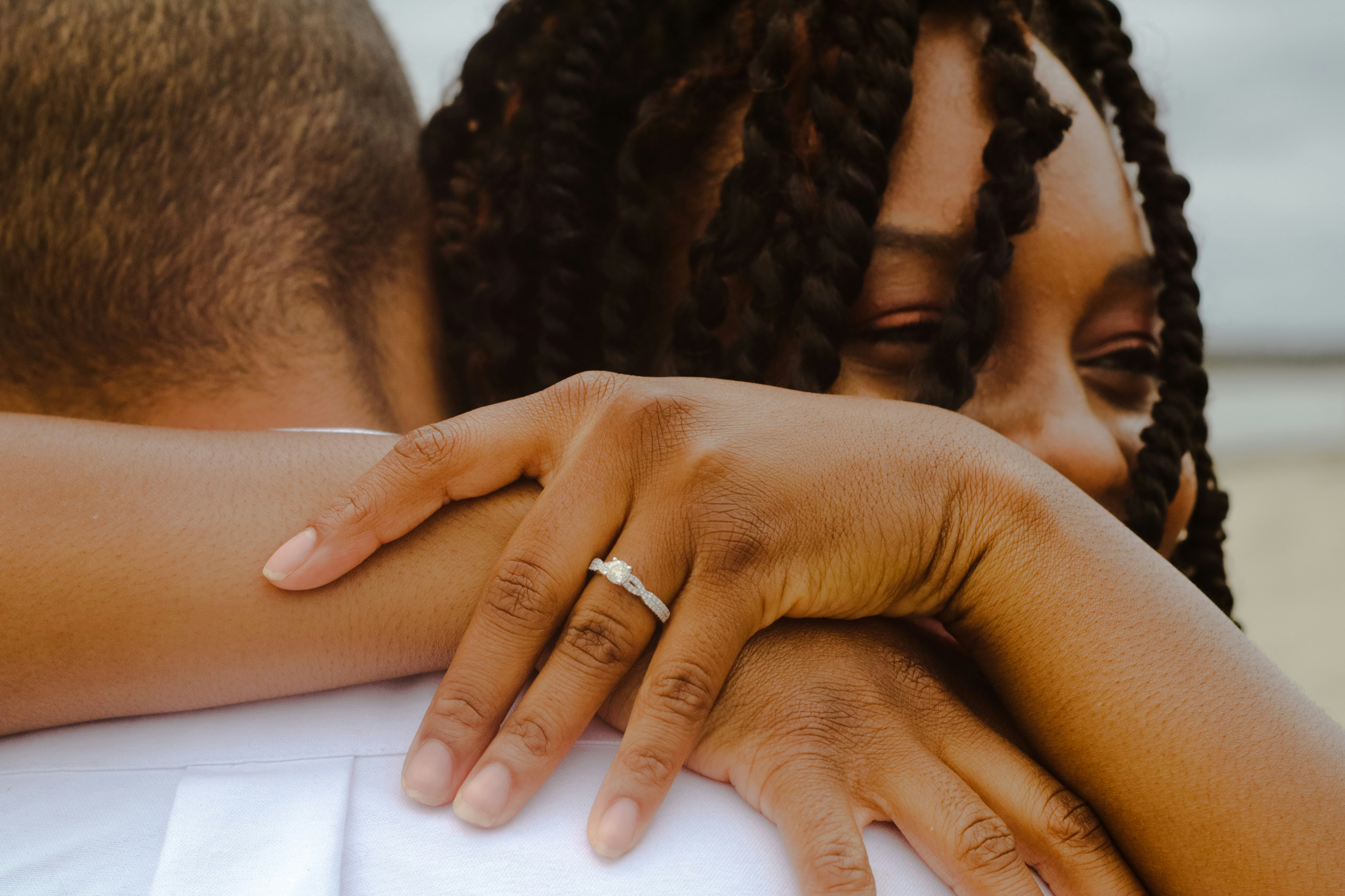 person wearing silver ring on left ring finger